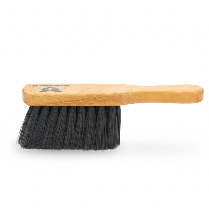 A Buffalo brand brush with a light natural wood handle and black bristles, shown on a white background with a green Buffalo logo in the top-left corner.