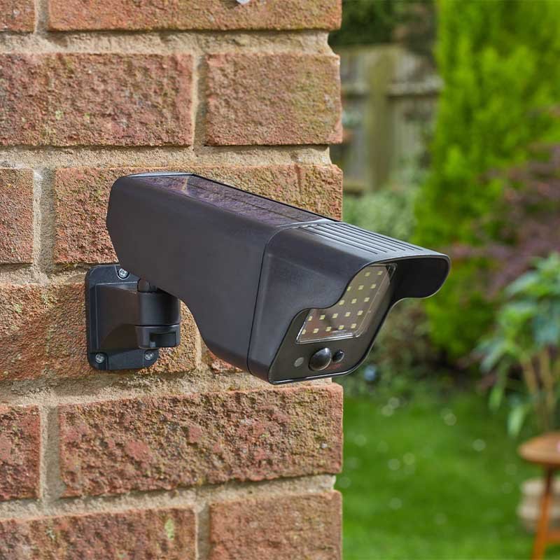 PIR Floodlight & Decoy Camera lifestyle - planter with plants on garden setting