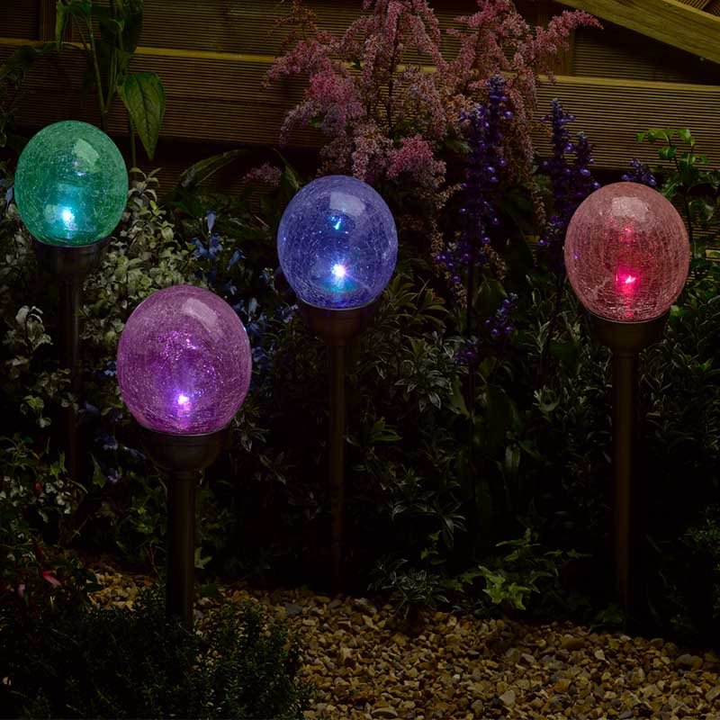 Classic Majestic Stake Light, 5pc lifestyle - planter with plants on garden setting
