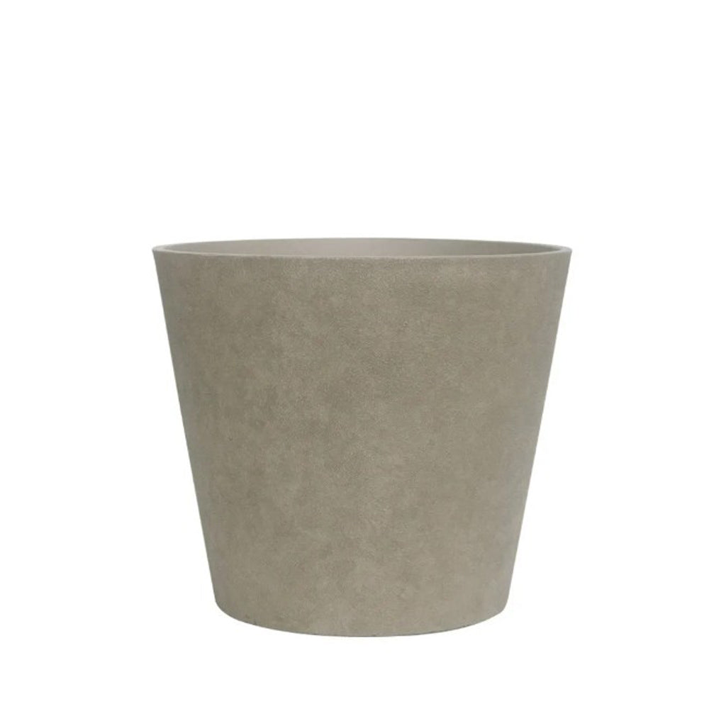 Hortus Lite - Aged Effect Plastic Planter -Vintage - Dia 50 x H44.5cm lifestyle - fibreglass stone-effect planter with lush greenery on modern garden terrace