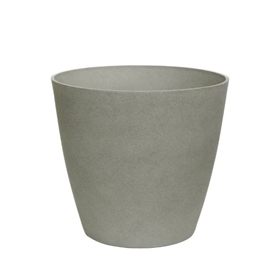Hortus Lite - Aged Effect Plastic Planter - Cement Grey - Dia 40 x Height 43cm lifestyle - concrete planter with lush greenery on modern garden terrace