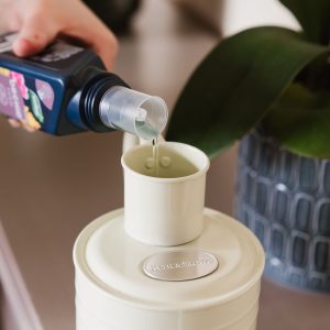 Westland Orchid Feed poured into watering can