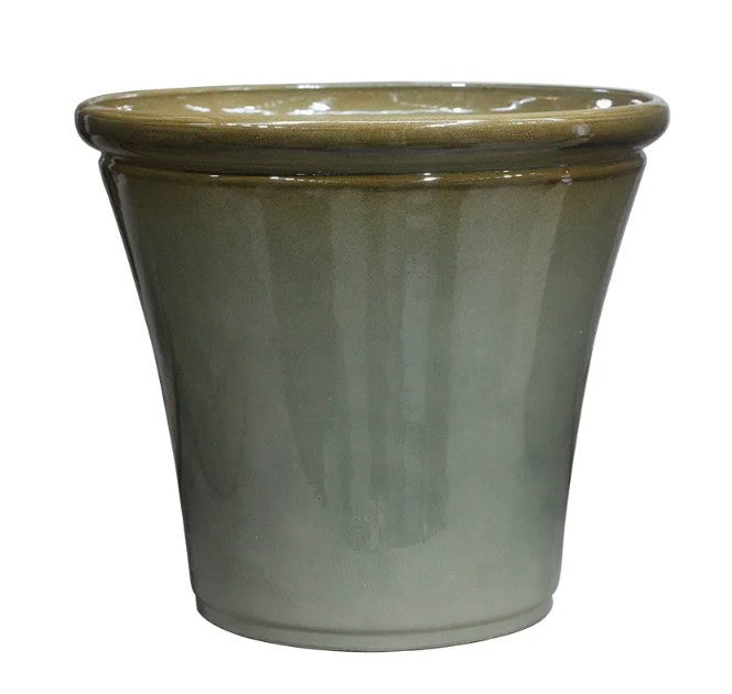 Hortus Lite - Glaze Plastic Rolled Rim Planter - Olive Green  - Dia 50 x Height 44cm lifestyle - fibreglass stone-effect planter with lush greenery on modern garden terrace